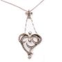 14 Karat Yellow white Gold Victorian Diamond Heart shaped pendant and .835 silver chain